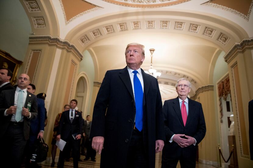 President Donald Trump, accompanied by Senate Majority Leader Mitch McConnell of Kentucky...