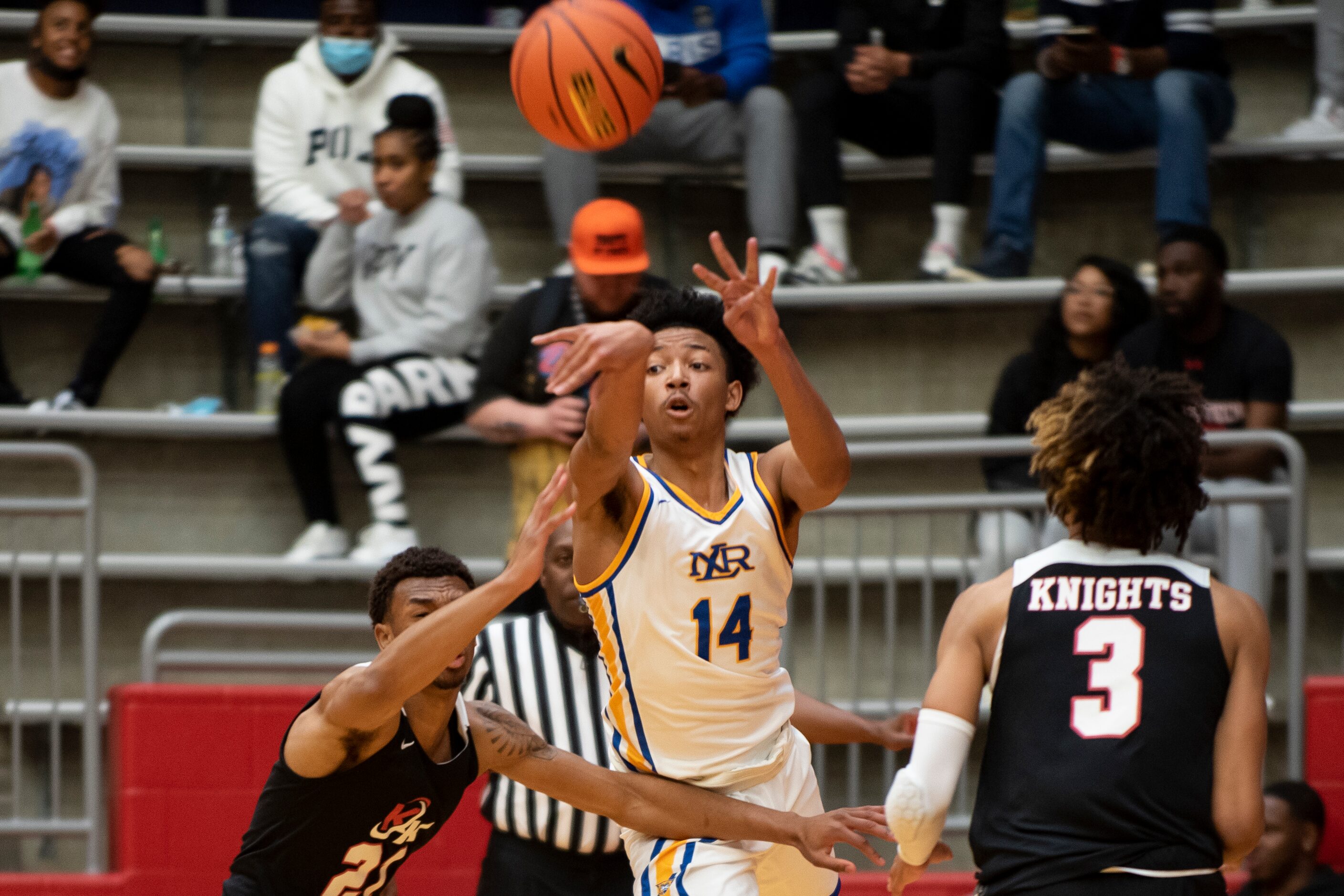 North Little Rock senior Nick Smith (14) passes the ball to a teammate during Kimball's...