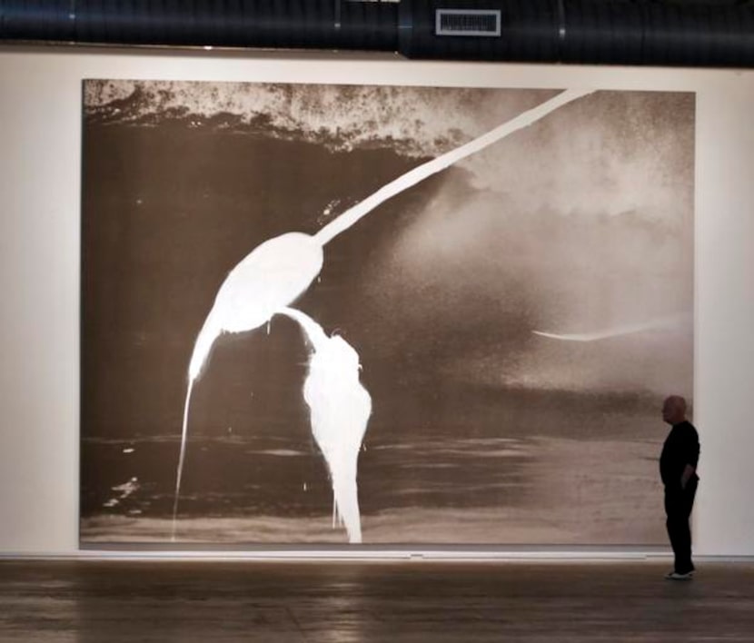 
Gordon Young of Dallas studies Julian Schnabel’s Painting for Malik Joyeux and Bernardo...