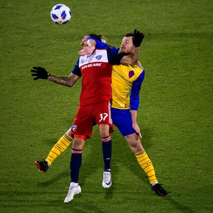 FC Dallas forward Maximiliano Urruti (37) fights for a head ball against Colorado Rapids...