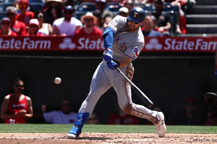ANAHEIM, CALIFORNIA - APRIL 07: Joey Gallo #13 of the Texas Rangers swings at a pitch in the...