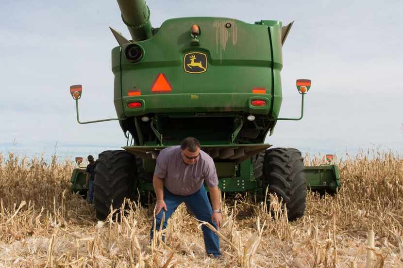 Dumas-area farmer Dee Vaughan checks the ground after a short test run in one of his...