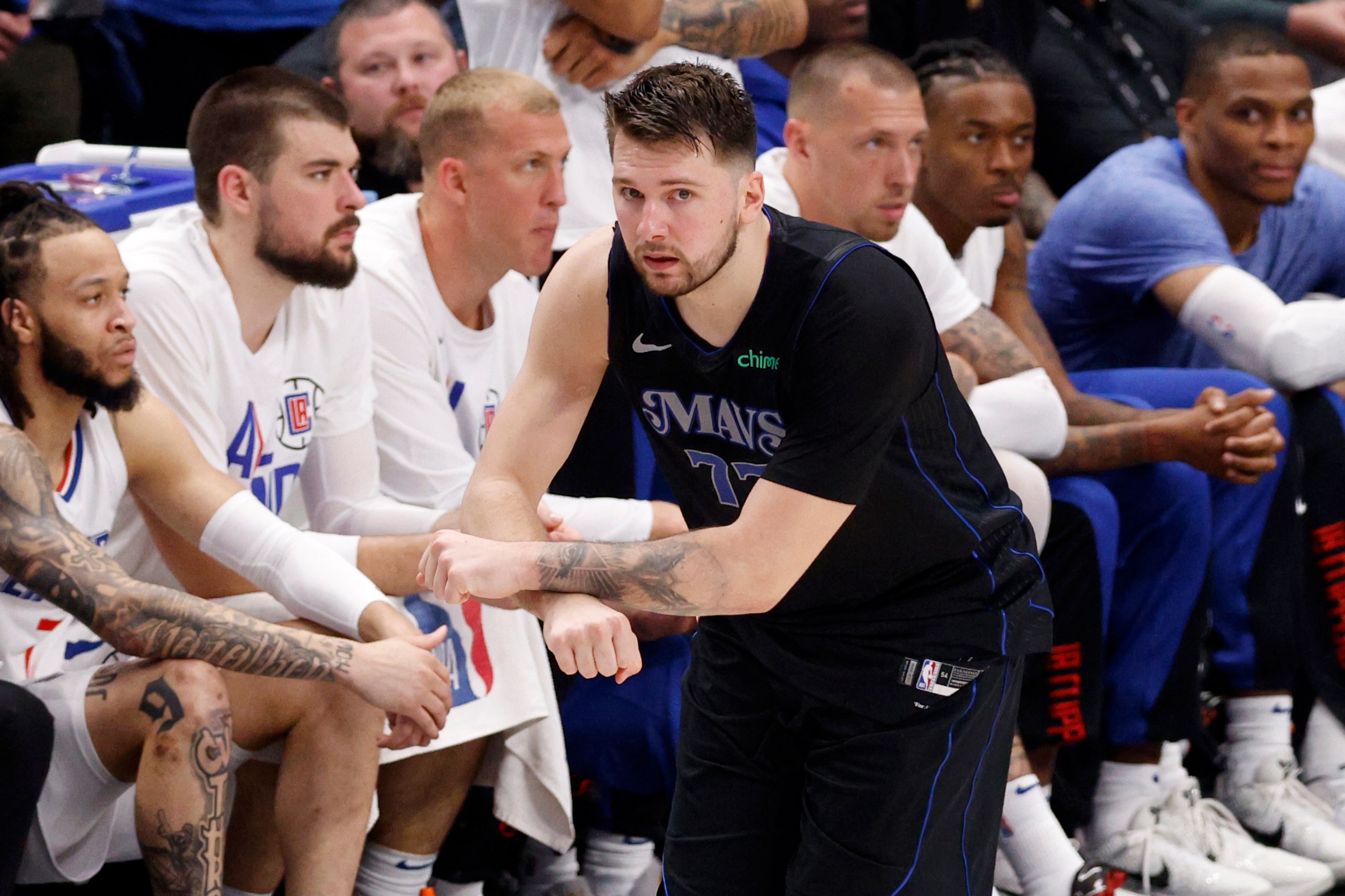 Dallas Mavericks guard Luka Doncic (77) reacts after facing a turnover from LA Clippers...