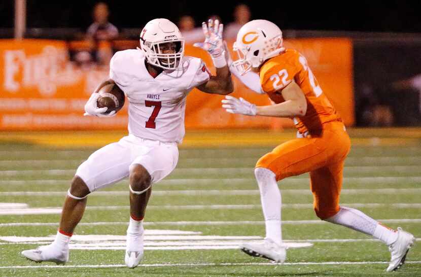 Argyle running back Don Williams (7) prepares to stiff-arm Celina's Skyler Bohall during...