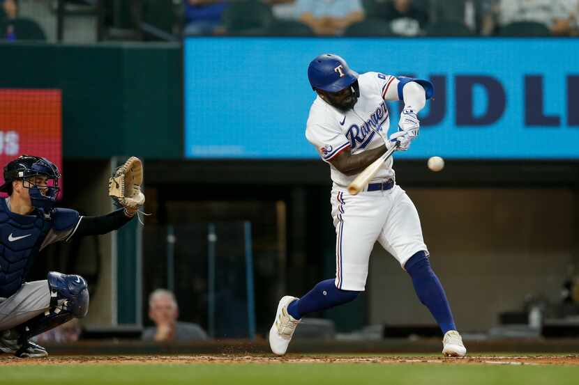Texas Rangers designated hitter Adolis Garcia (53) hits a two-run home run during the fifth...