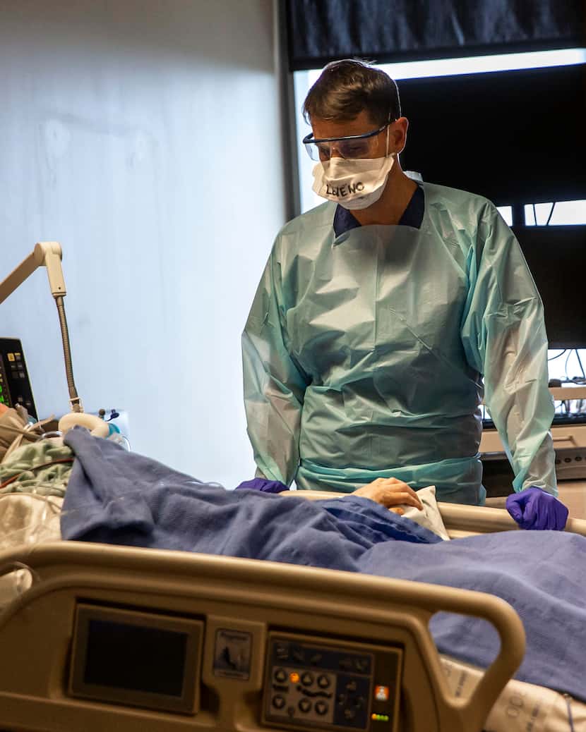 Dr. Matt Leveno, medical director of the Tactical Care Unit, monitors an intubated and...