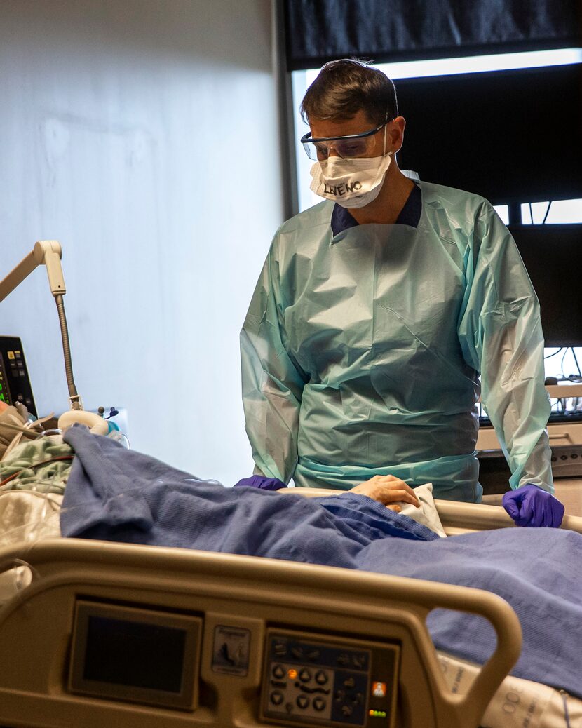 Dr. Matt Leveno, medical director of the Tactical Care Unit, monitors an intubated and...