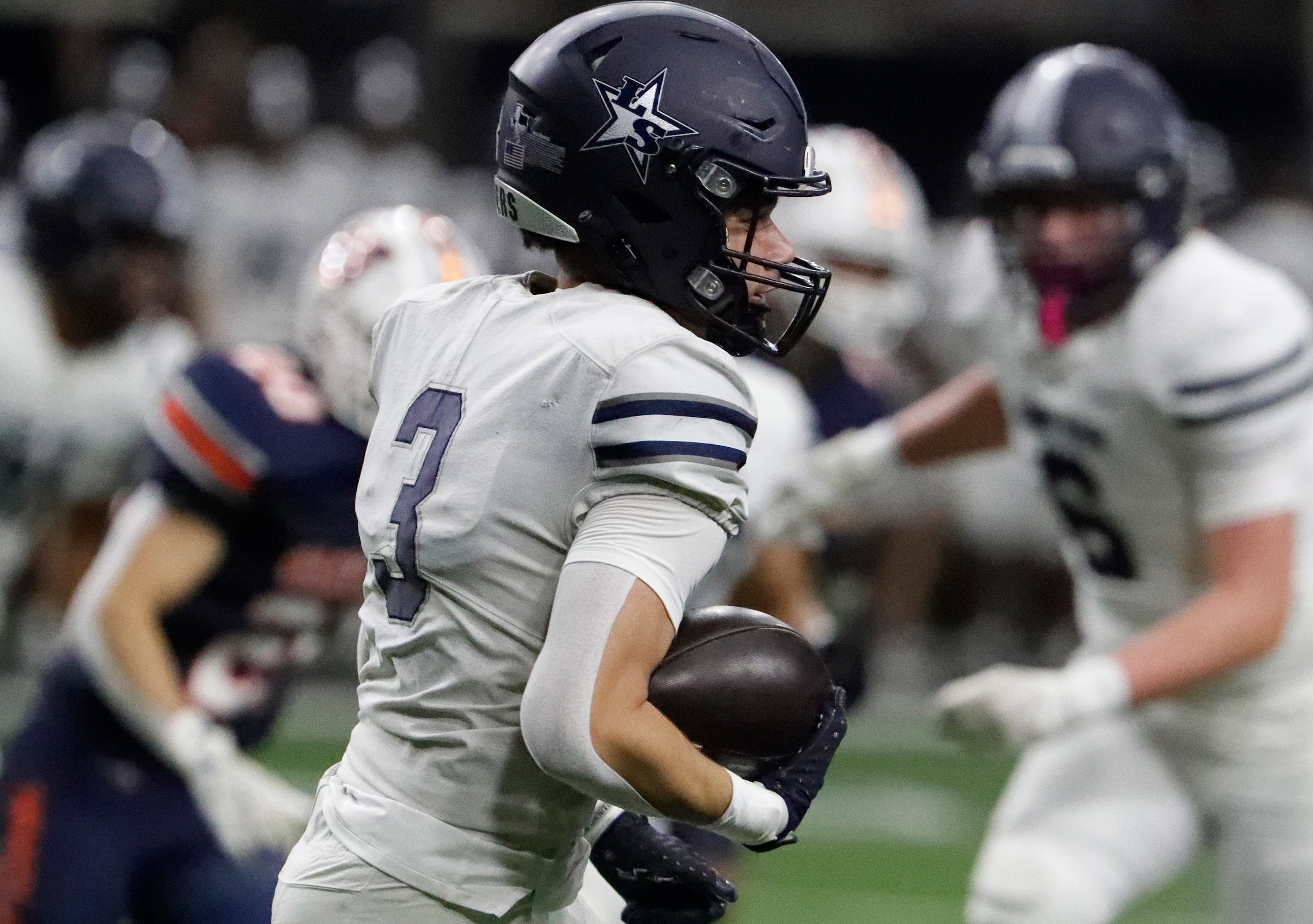 Lone Star High School quarterback Marcus Vaughn (3) returns a kick during the first half as...