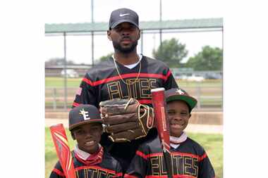 Denzel Branch pictured with his son Royce (right) and stepson Daniel (left). Branch coached...