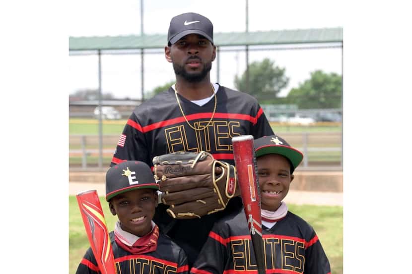 Denzel Branch pictured with his son Royce (right) and stepson Daniel (left). Branch coached...