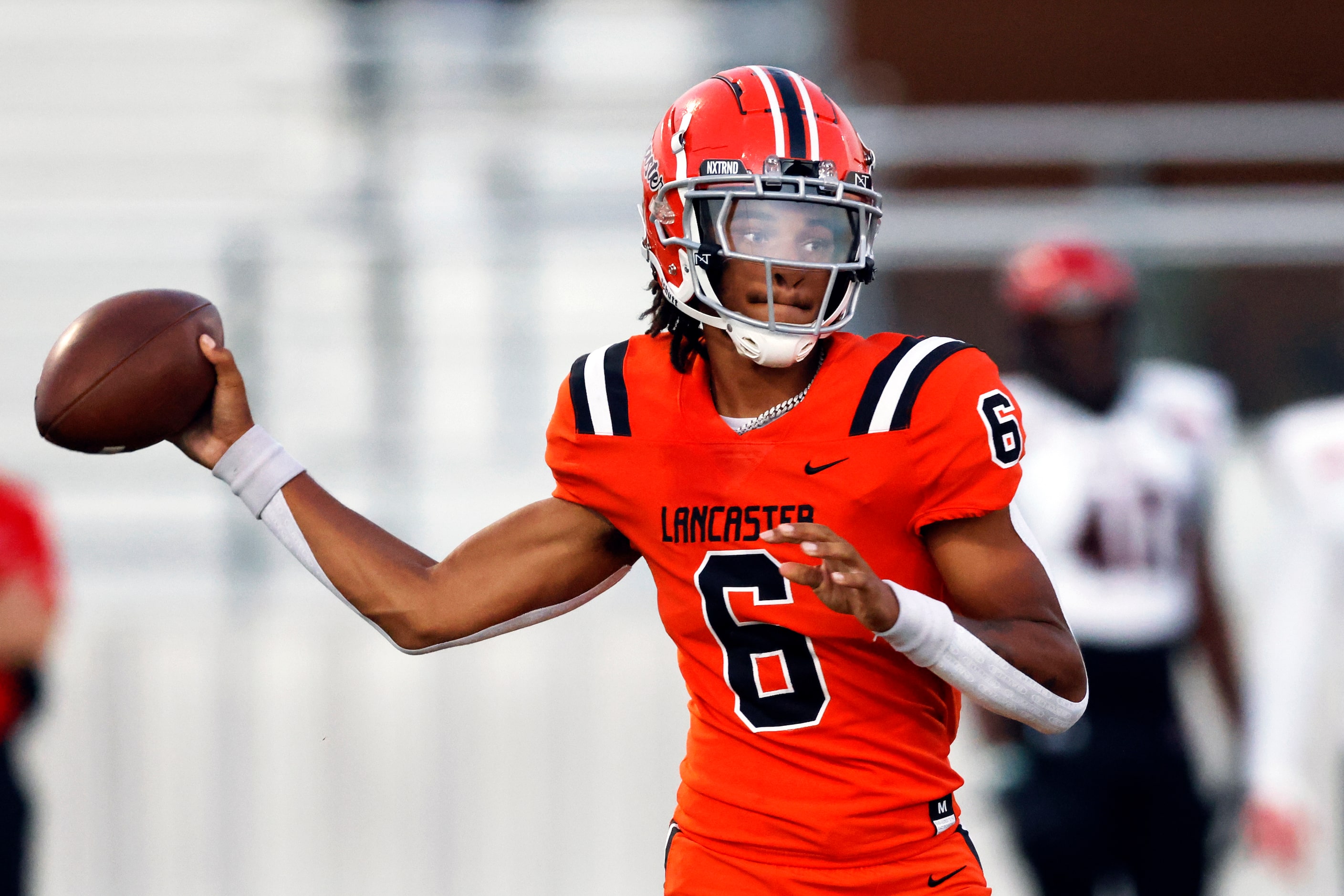 Lancaster quarterback Carter Jones (6) throws a pass during the first half of a district...