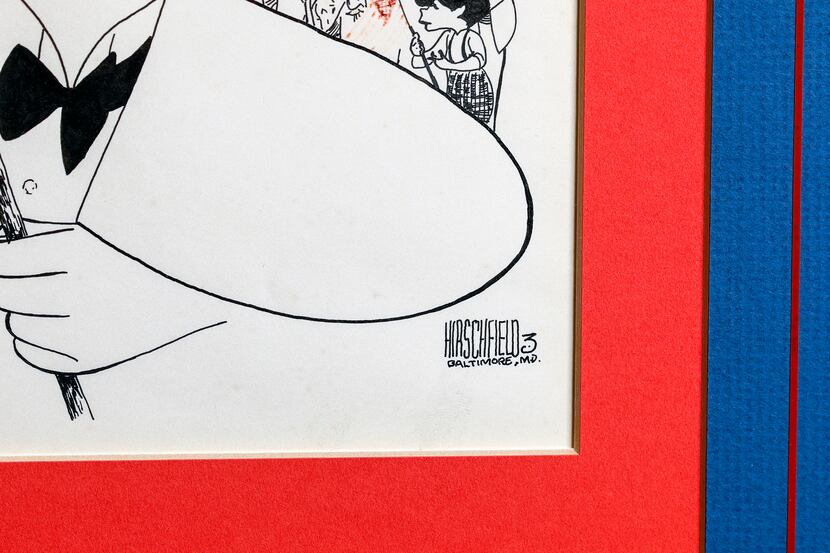 A detail view of the drawing purported to be by Al Hirschfeld features a signature and the...