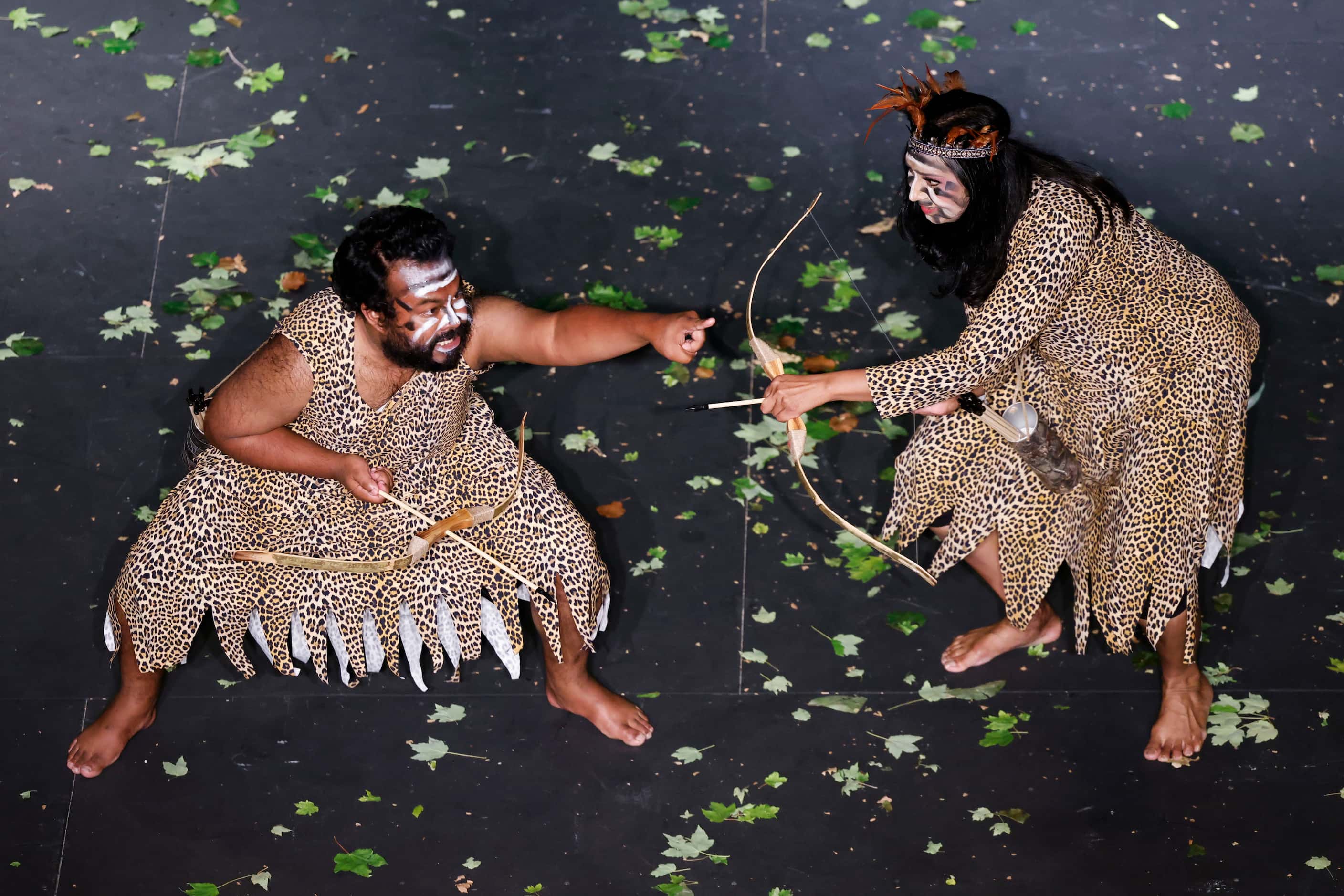 Tausif Chowdhury (left), and Sabira Keya, both playing as Chandal, take part in a play,...