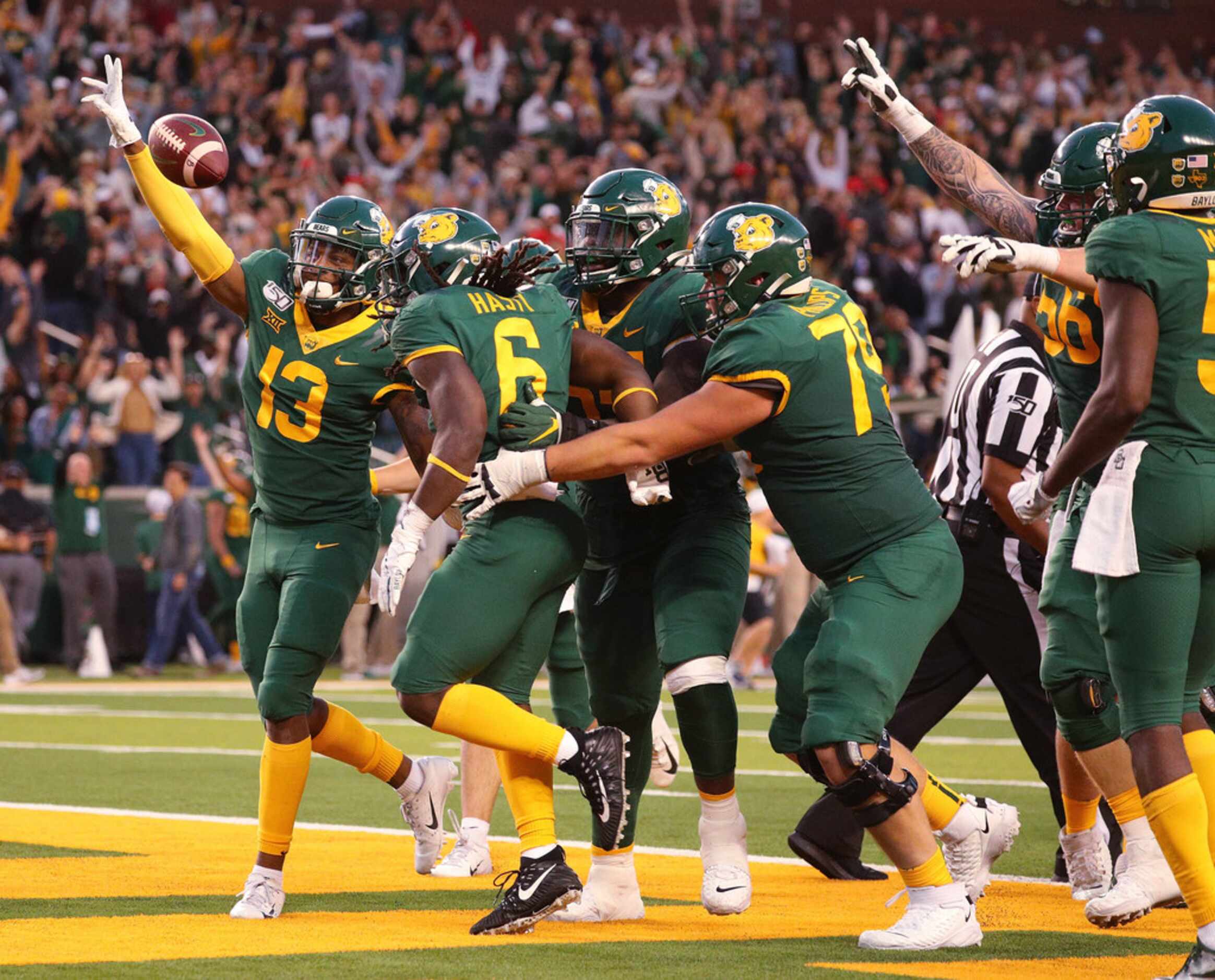 WACO, TEXAS - OCTOBER 12: The Baylor Bears celebrate the overtime win against the Texas Tech...