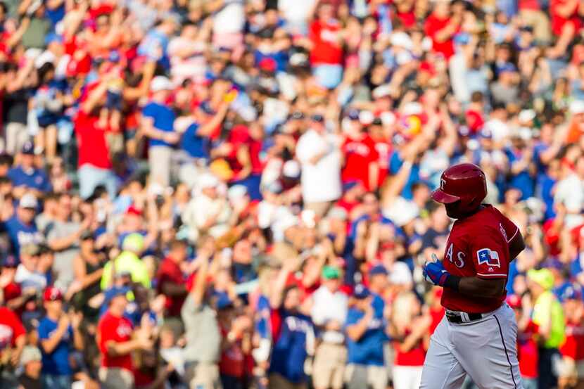 Texas Rangers third baseman Adrian Beltre rounds the bases after hitting a two-run home run...