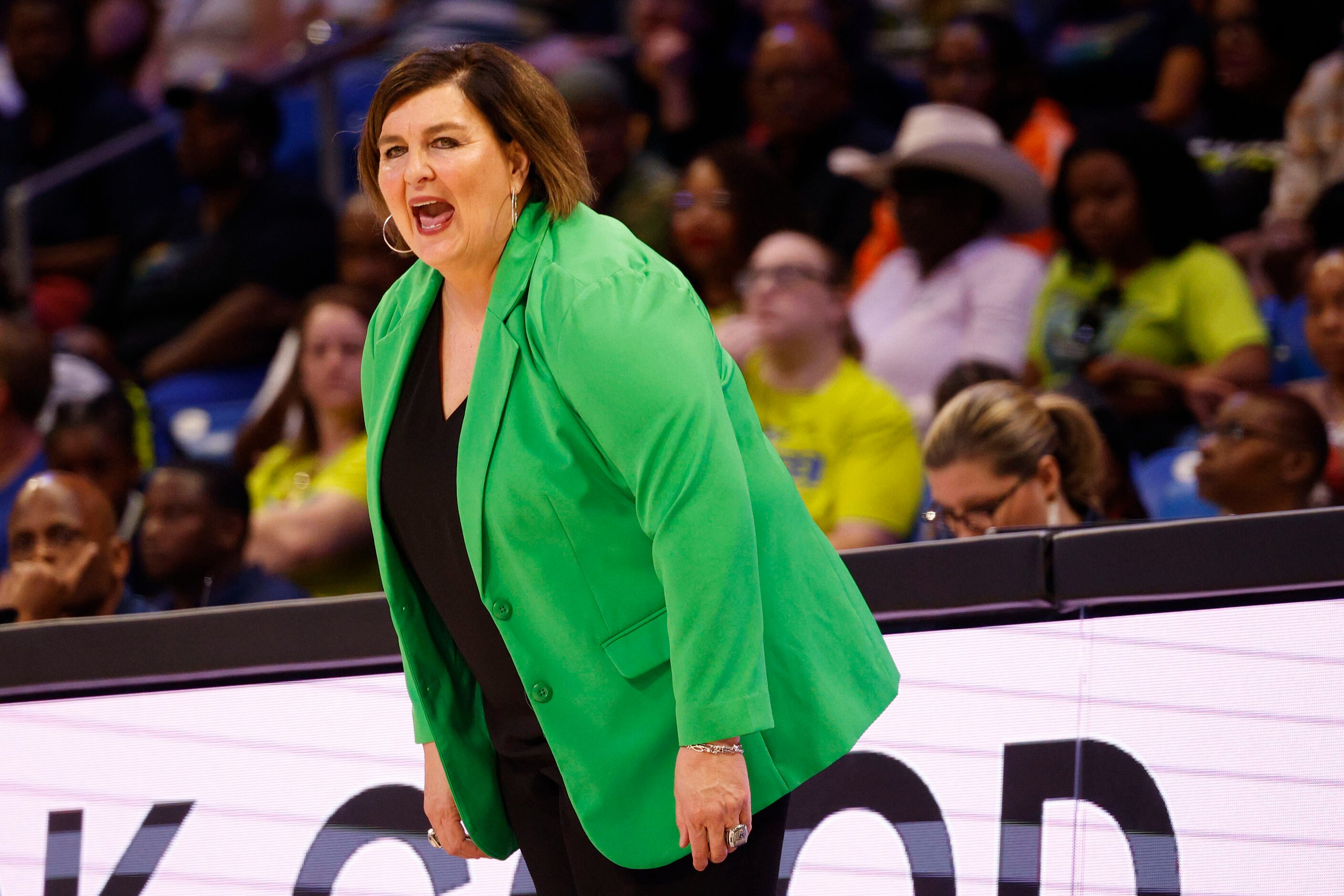 Dallas Wings head coach Latricia Trammell watches her players during the first half of a...