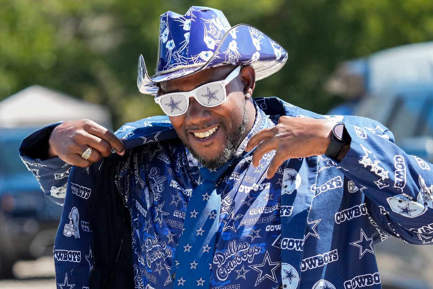 Dallas Cowboys fan Edwin Fox, of Tampa, Fla., dons a complete Cowboys suit while tailgating...