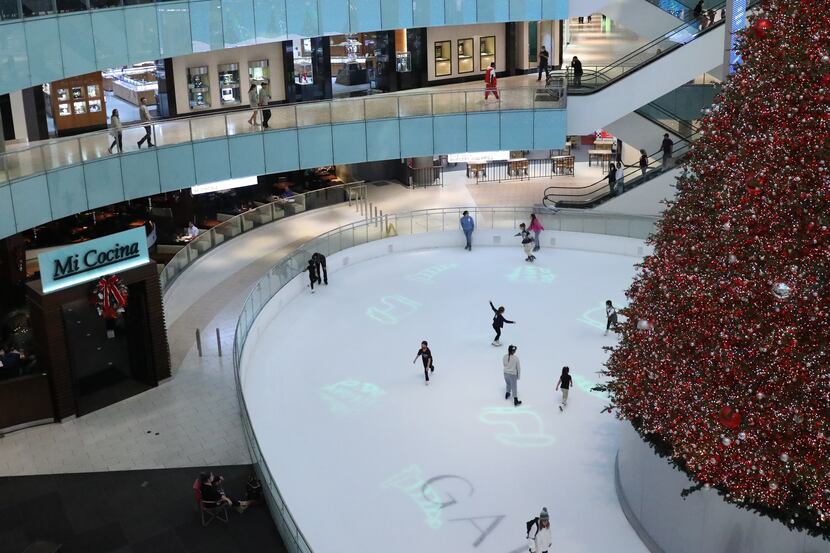 The Dallas Galleria's 95-foot tall tree sits in the center of the mall's ice skating rink as...