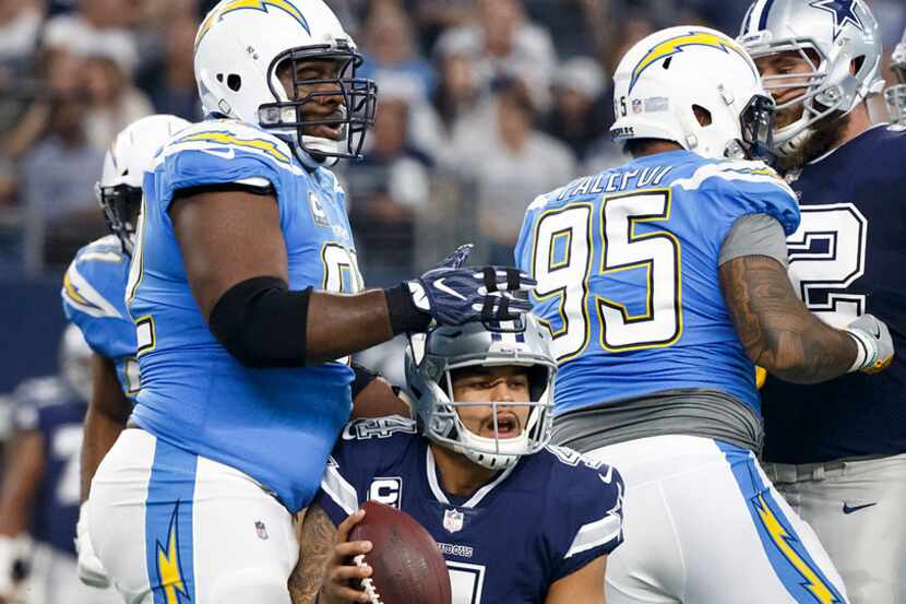Los Angeles Chargers nose tackle Brandon Mebane (92) and defensive end Tenny Palepoi (95)...