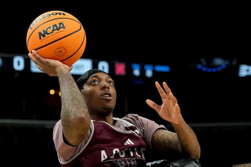 Texas A&M guard Wade Taylor IV shoots the ball during a practice for the team's first-round...