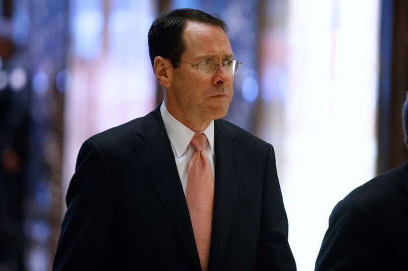 AT&T CEO Randall Stephenson arrives in the lobby of Trump Tower in New York on Thursday...