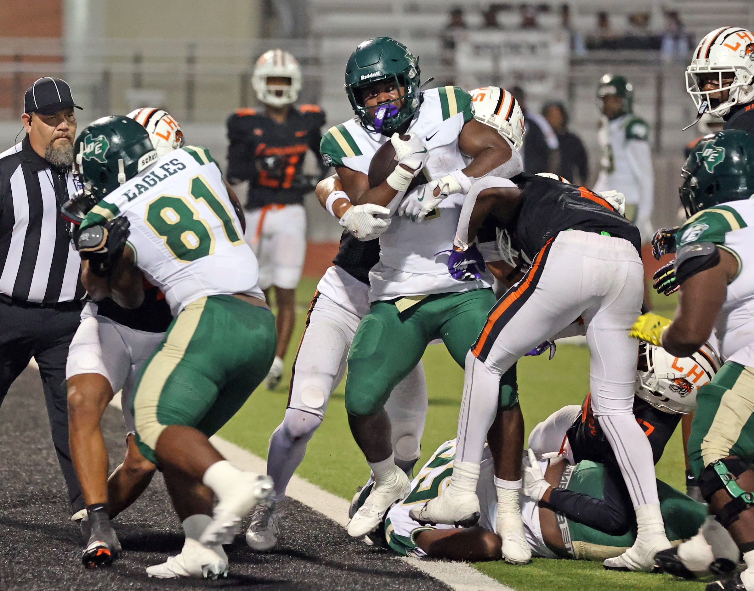 DeSoto High RB Deondrae Riden Jr. (1) crosses into the end zone for a touchdown during the...