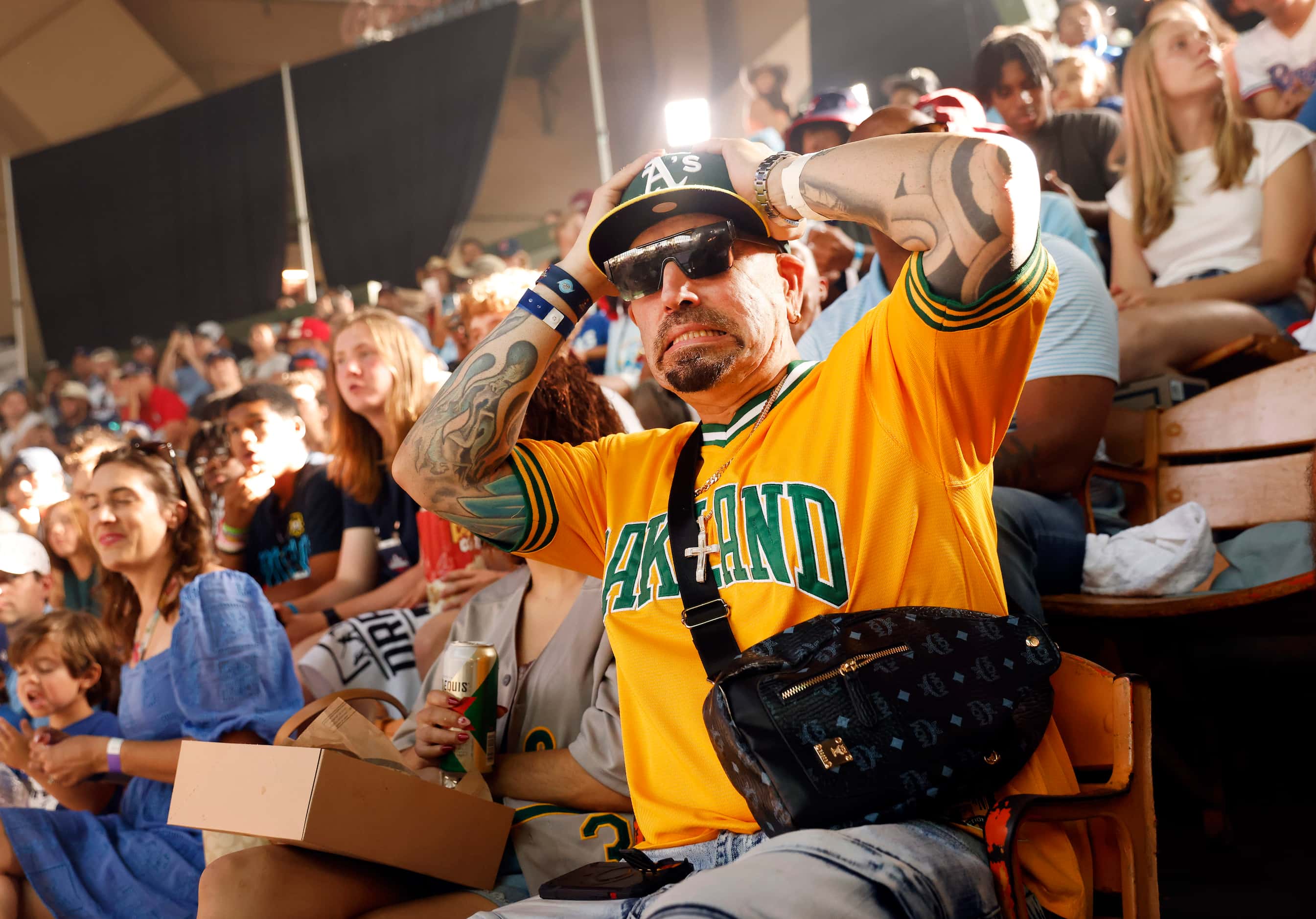 Oakland A’s fan Sam Freund of Fort Worth reacts to the fourth pick during Day 1 of the MLB...