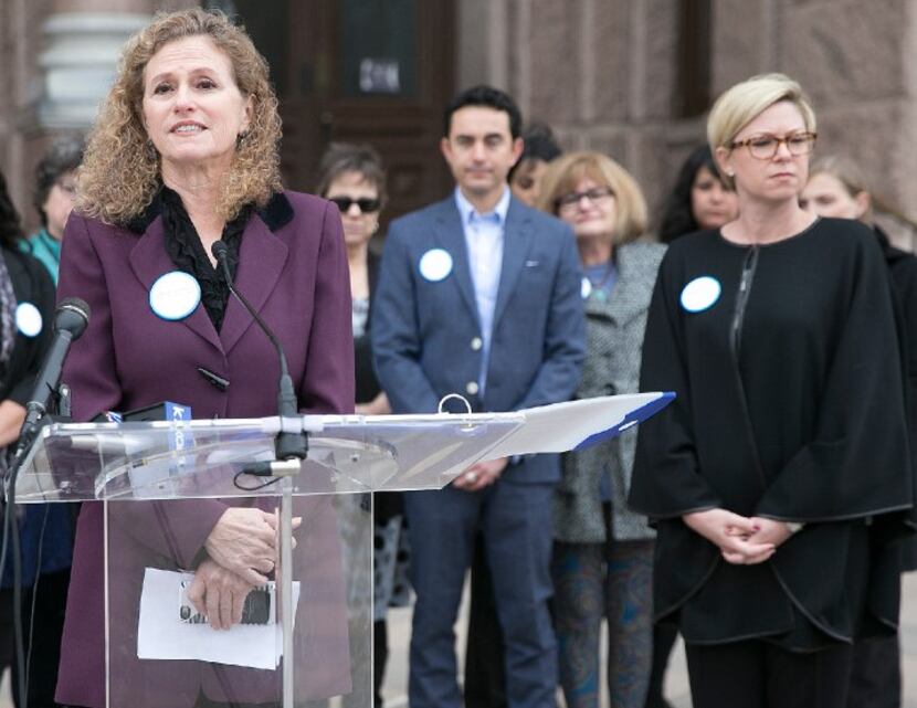 Rep. Donna Howard, D-Austin (left), shown at a December vaccination-policy event with Rep....