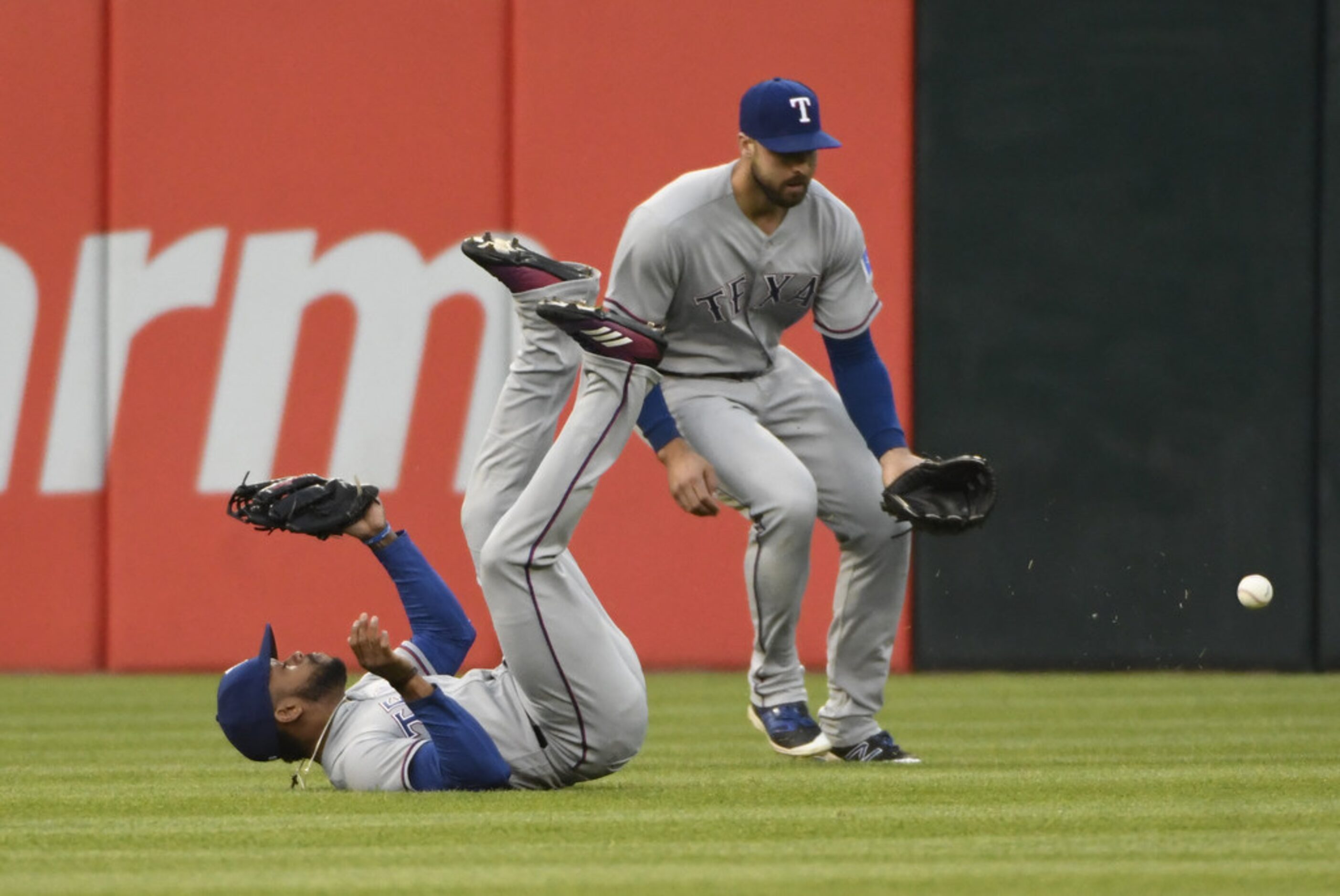 CHICAGO, IL - MAY 17: Delino DeShields (L) and Joey Gallo #13 of the Texas Rangers can't...