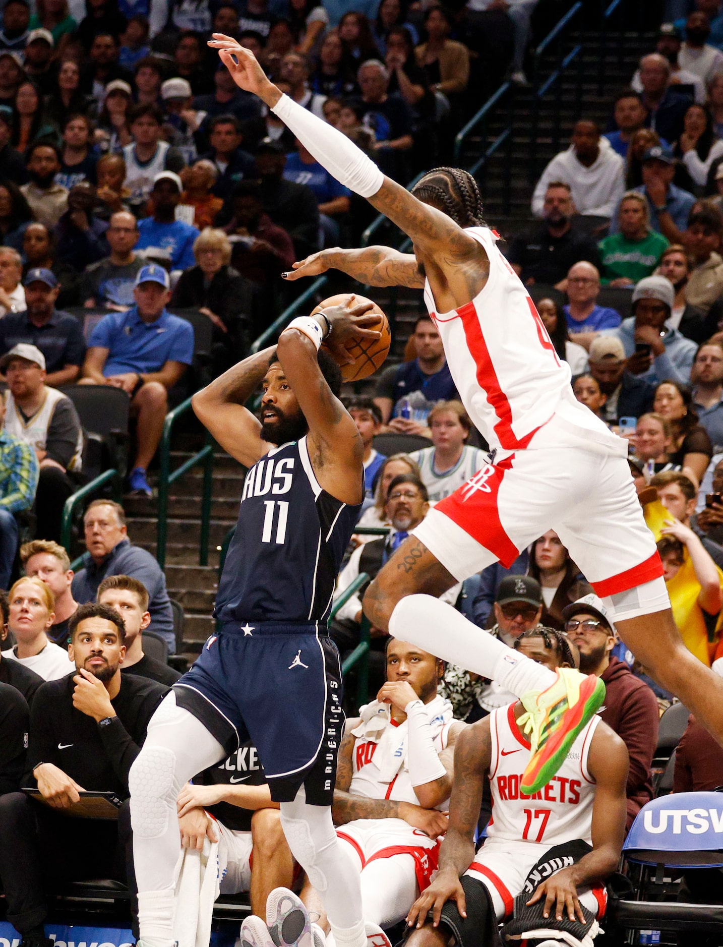 Houston Rockets guard Jalen Green (4) tires to get the ball as Dallas Mavericks guard Kyrie...