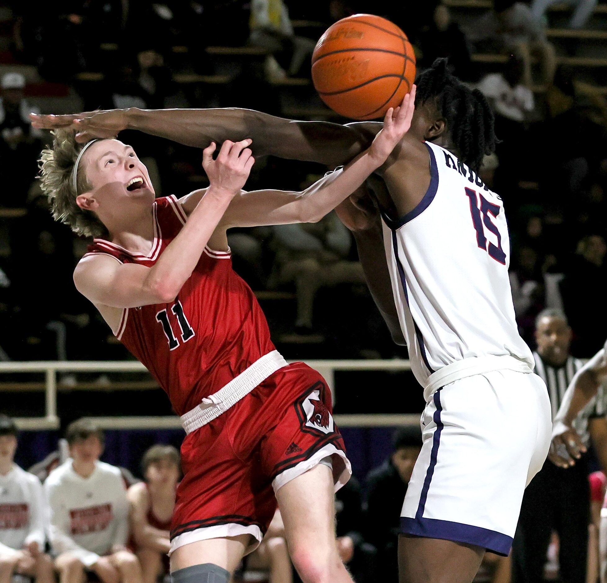 Woodrow Wilson guard Brian Kirby (11) goes up for a shot against Kimball forward Able...