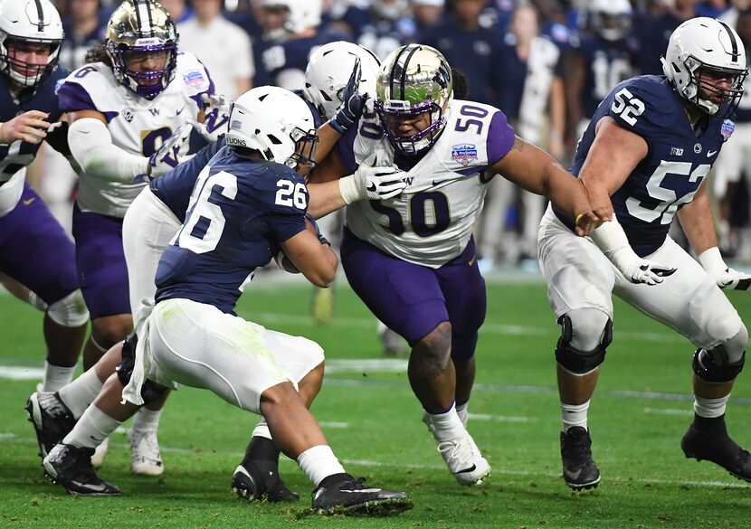 GLENDALE, AZ - DECEMBER 30: Washington defensive tackle Vita Vea (#50) attempts to tackle...