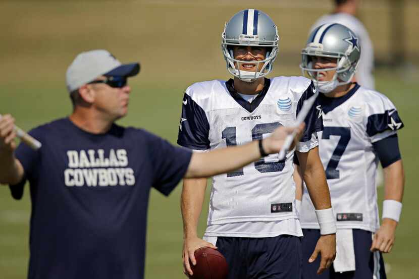 Dallas Cowboys quarterback Matt Cassel (16)  and Kellen Moore, (17) listen to offensive...