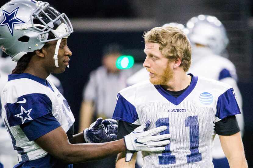 Dallas Cowboys wide receiver Lucky Whitehead (13) and wide receiver Cole Beasley (11) talk...