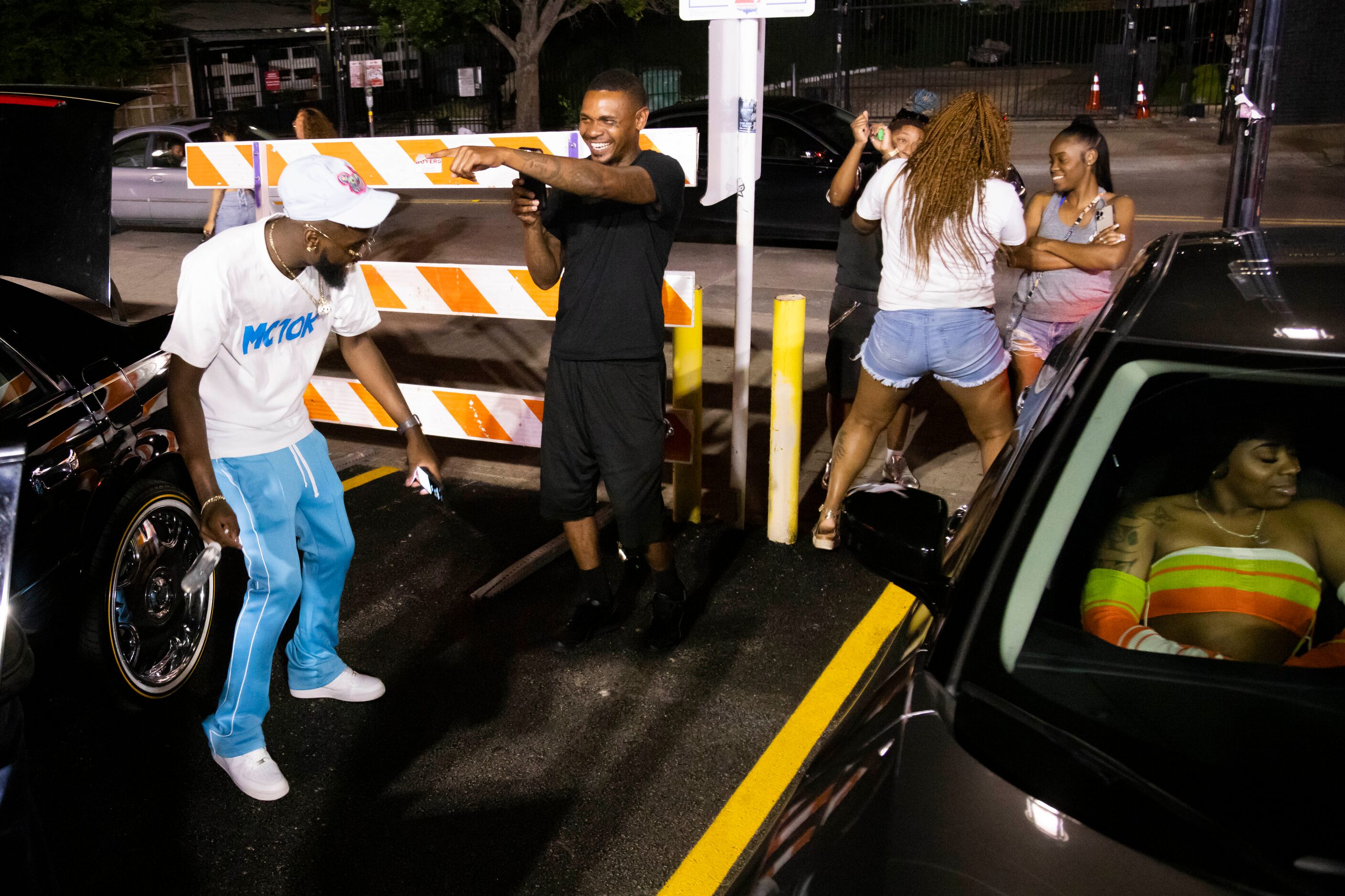 Johnathan Coleman records as MC 10K dances in the parking lot outside of Nines in the Deep...