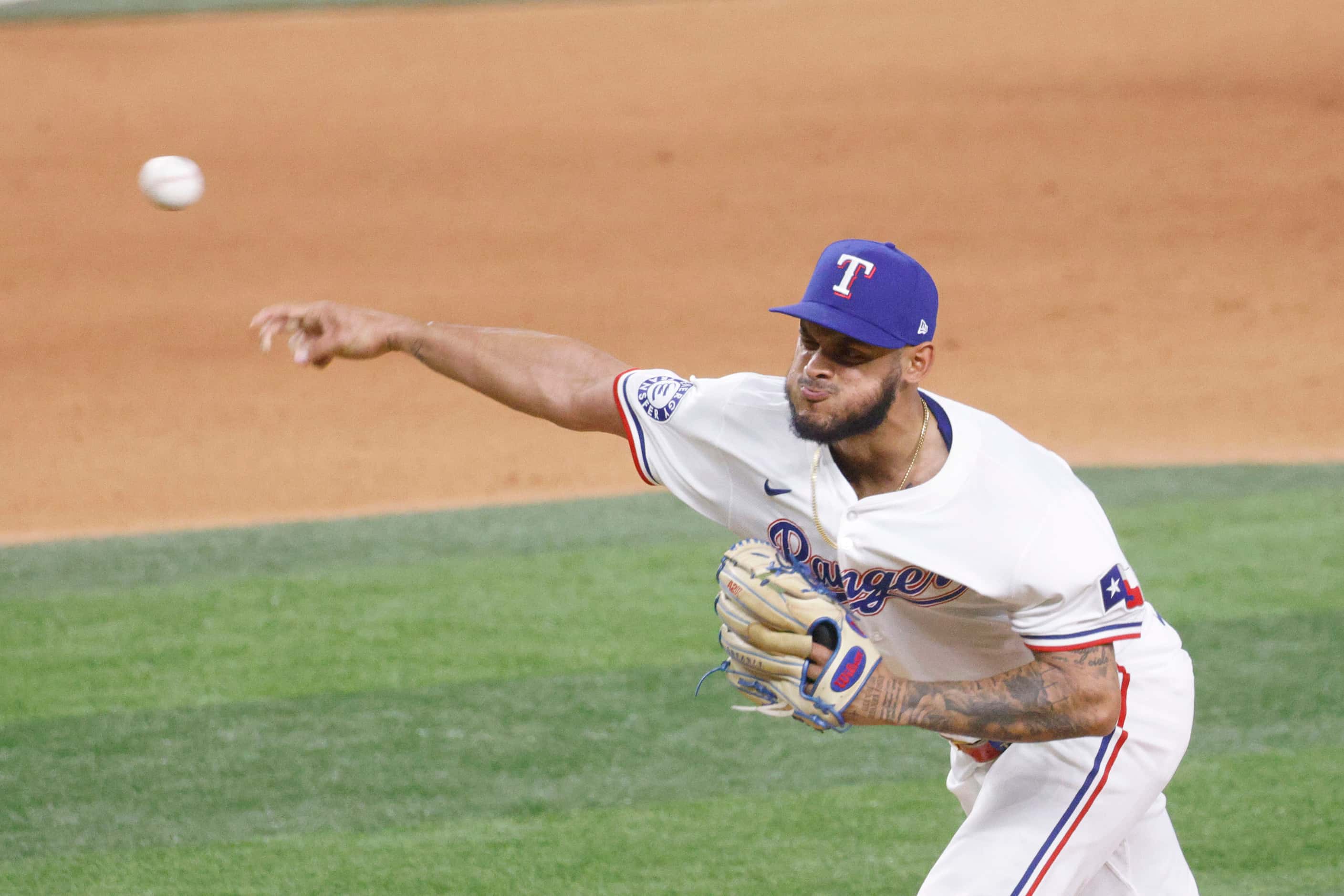 Texas Rangers pitcher Jonathan Hernández (72) delivers during the eighth inning of a...