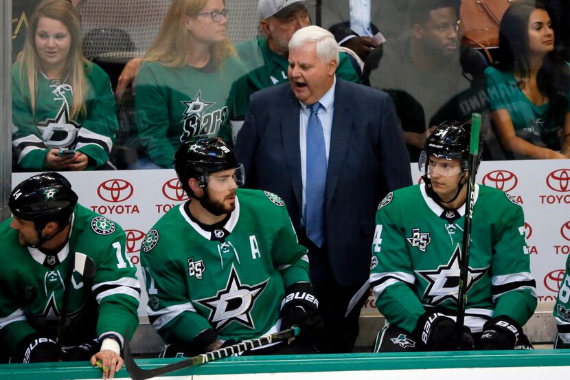Dallas Stars head coach Ken Hitchcock, center, gives instructions to the bench as Jamie Benn...