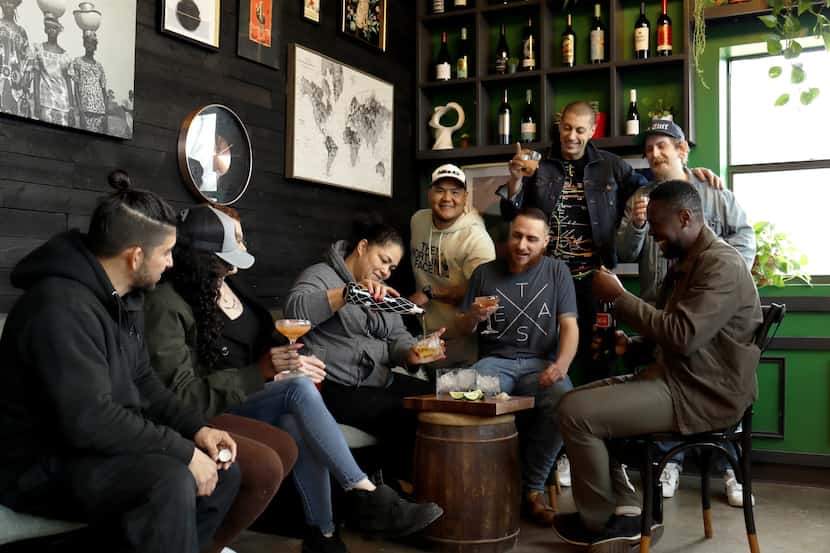 Cafe Americana's staff gather around liquor ahead of Copa America. The restaurant expects to...