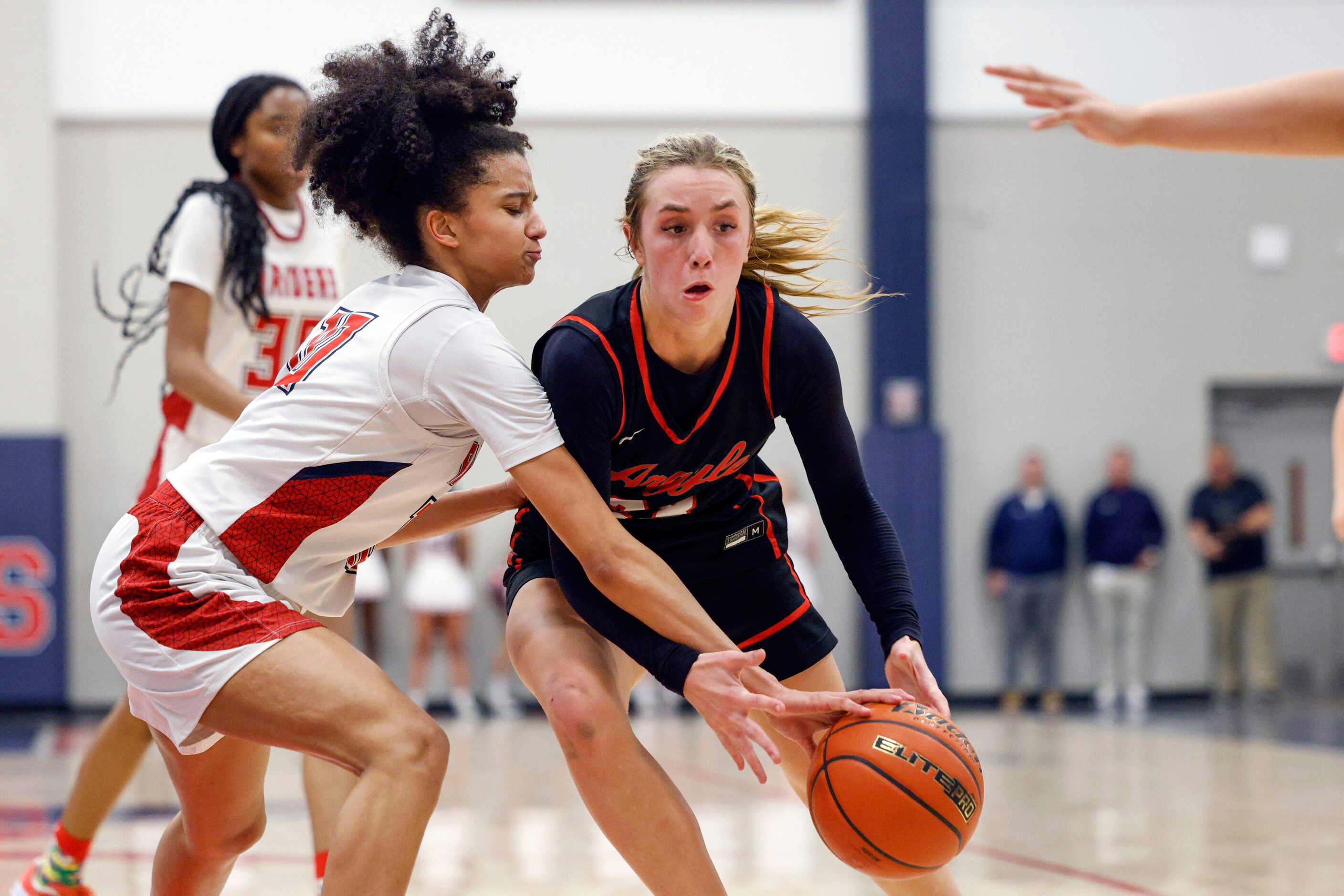 Denton Ryan forward Kinley Lewis (10) knocks the ball loose from Argyle guard Kennedy Hafer...