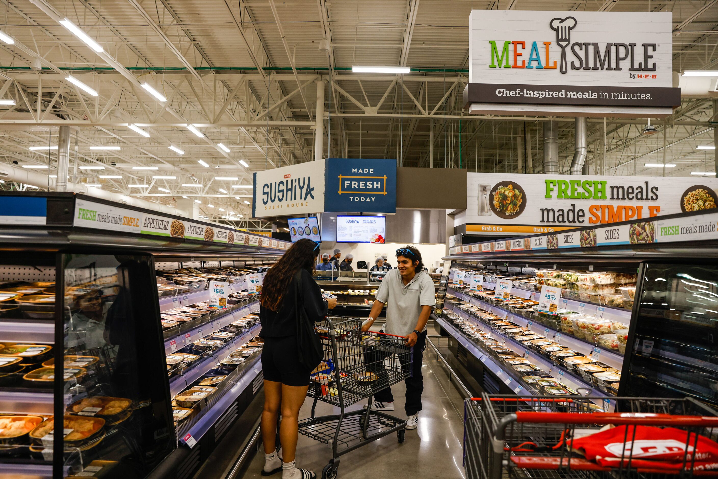 Customers chat as they shop.