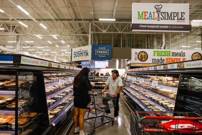 Customers do their regular grocery shopping at the new H-E-B store in Frisco.