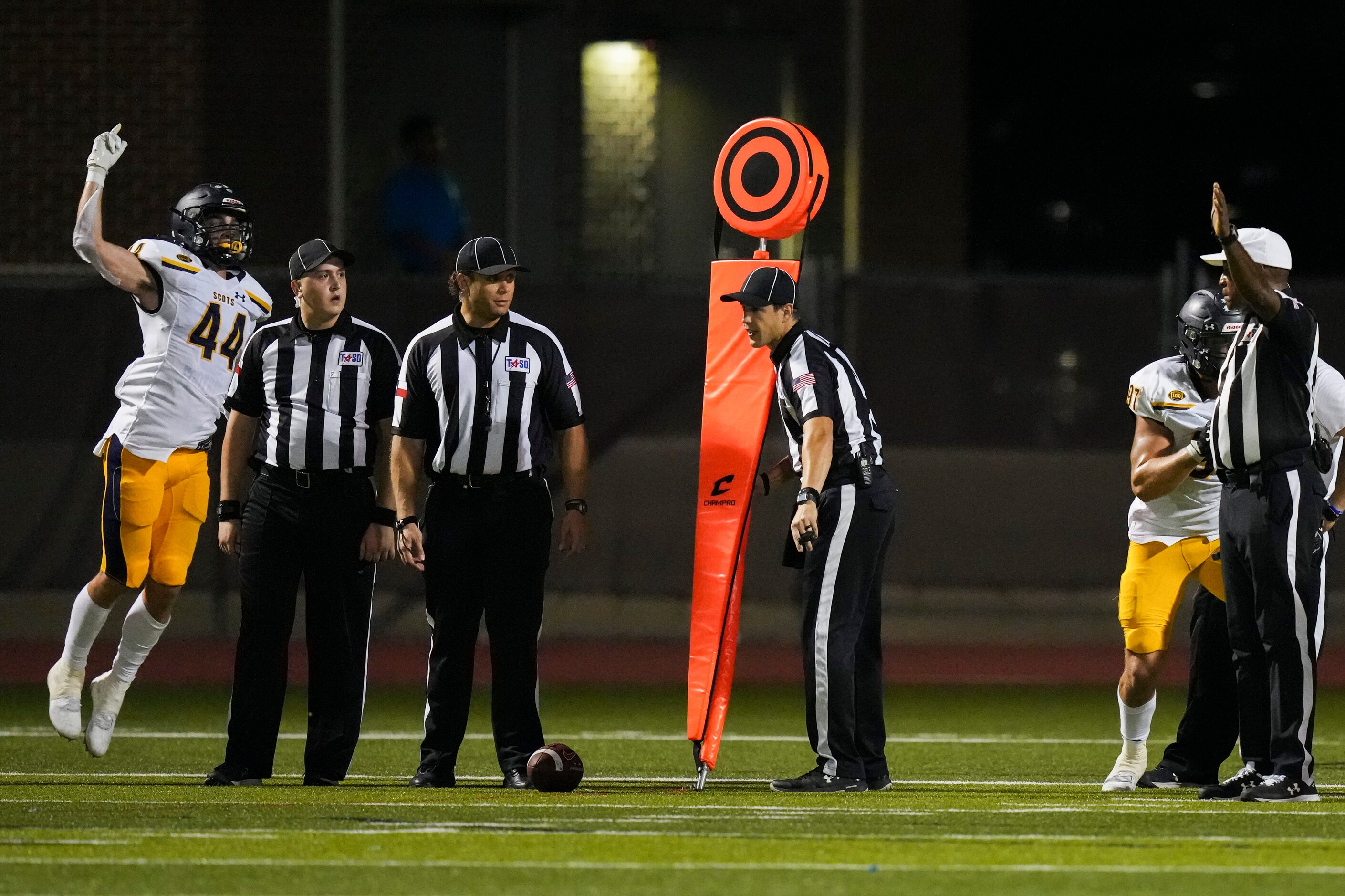 Highland Park’s Charlie Barton (44) celebrates after the official measurement resulted in a...