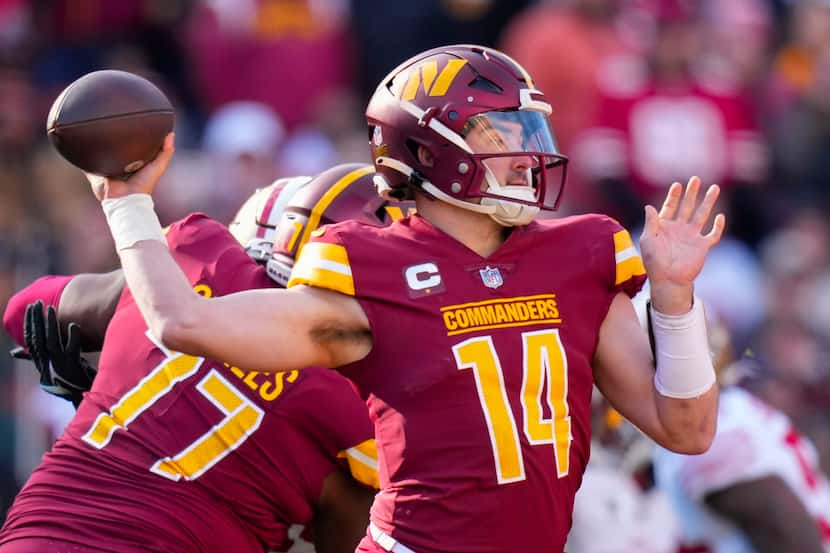 FILE 0 Washington Commanders quarterback Sam Howell (14) throws a pass during the first half...