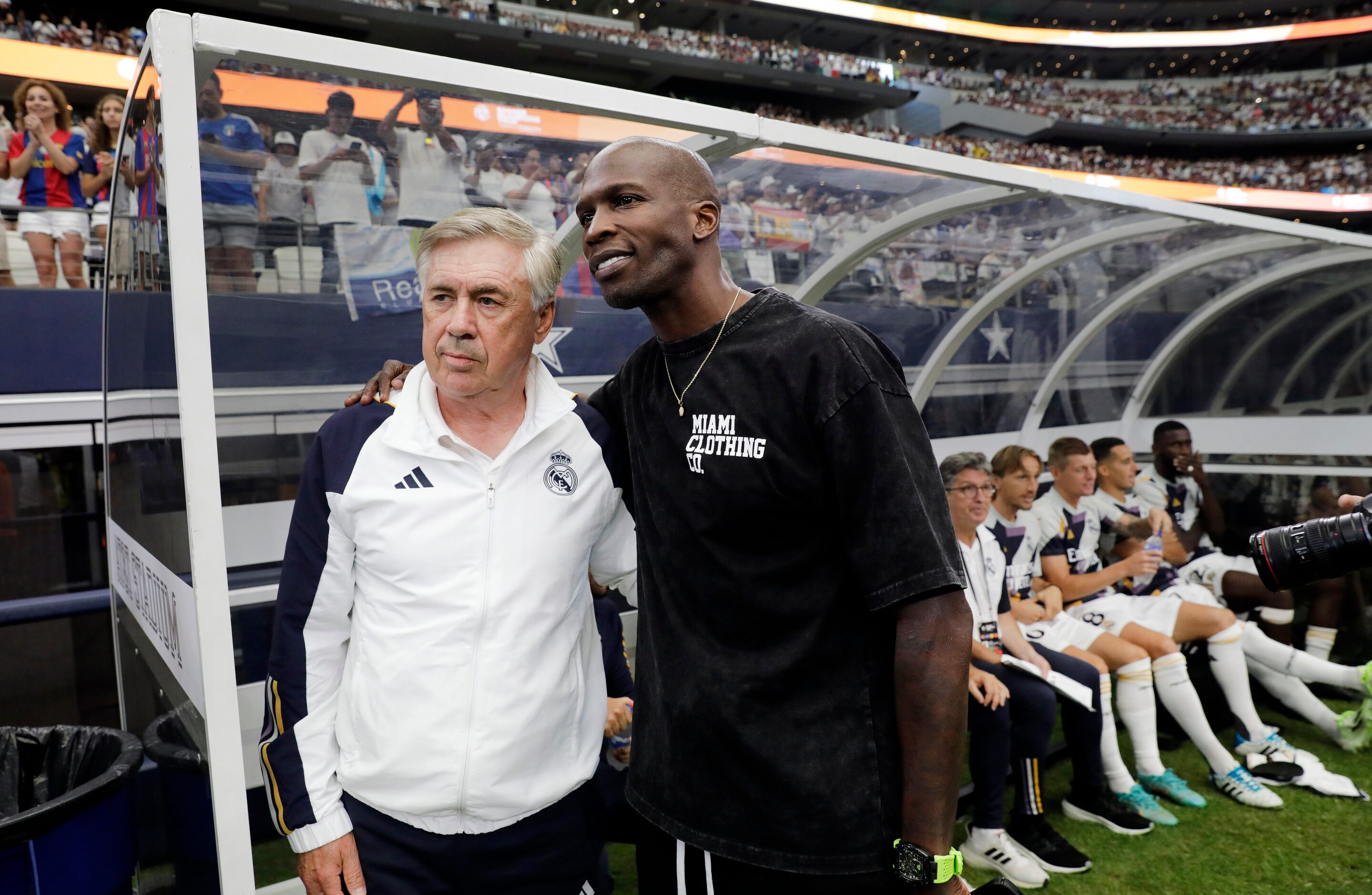 Real Madrid coach Carlo Ancelotti (left) poses for a photo with former NFL player Chad...