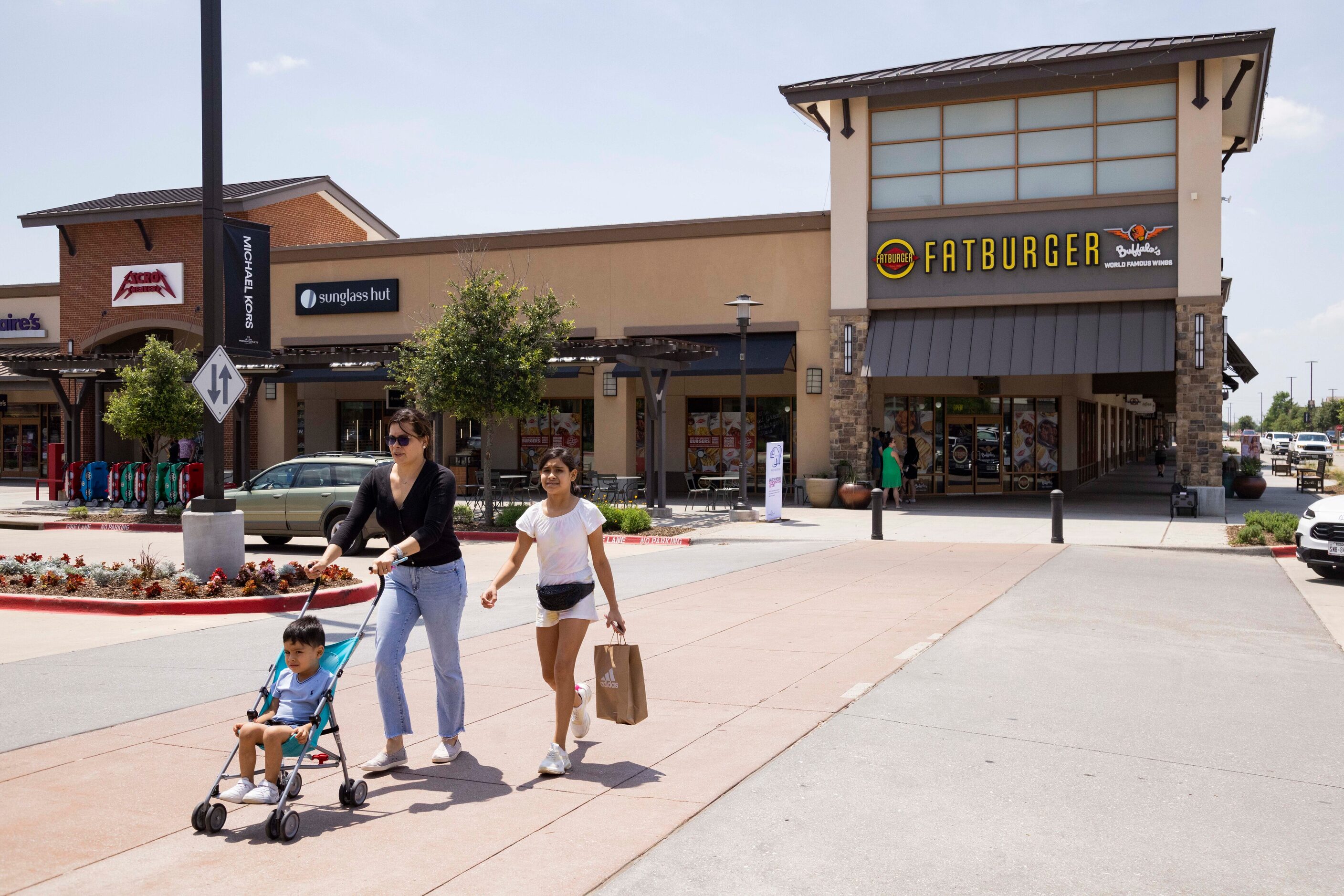 Ilse Ledesma from Mexico walks with daughter Isabella Ledesma, 11, and son Armando Ledesma,...