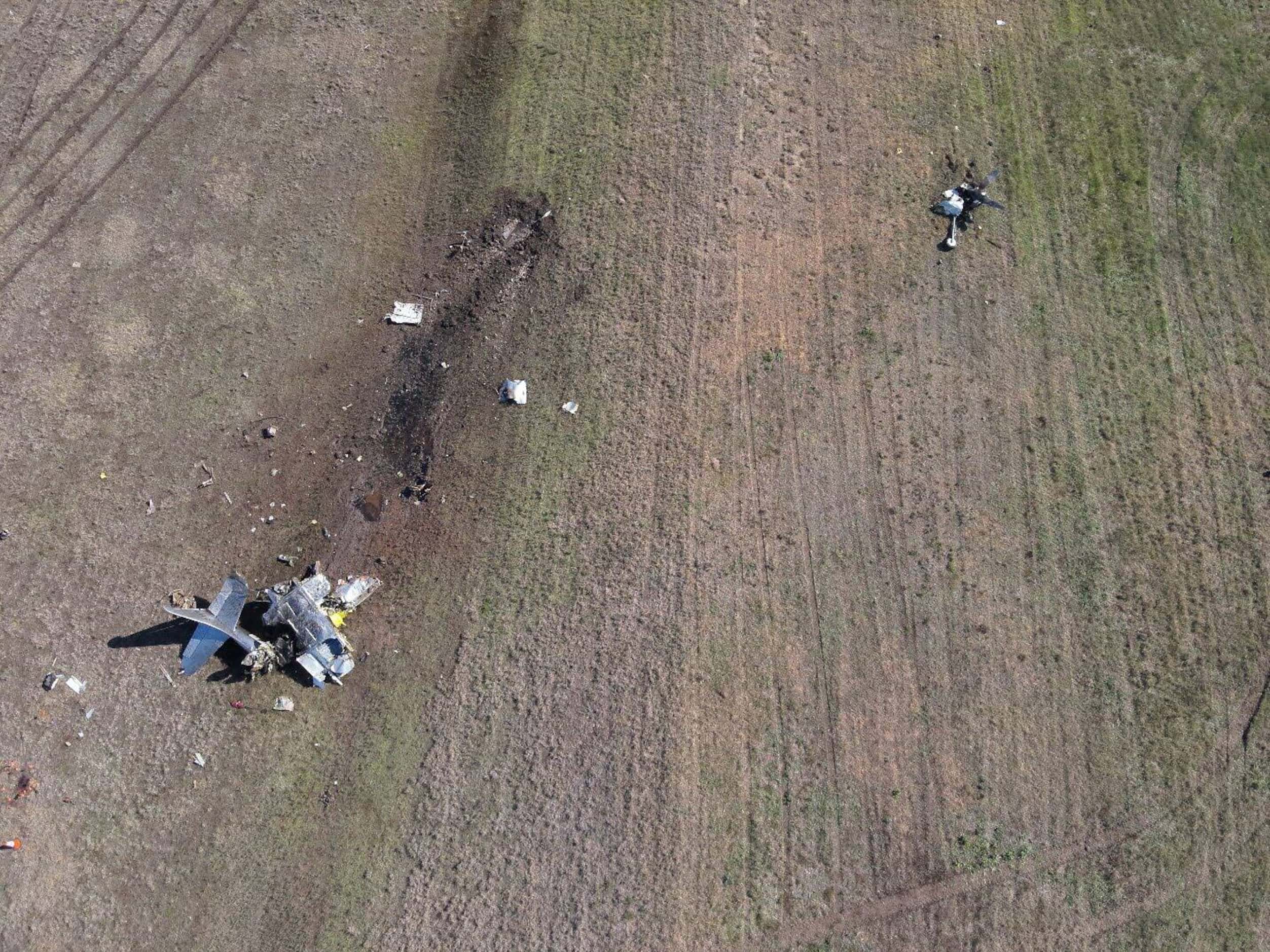 Aerial view of P-63F main wreckage following a mid-air collision at Dallas Executive Airport...