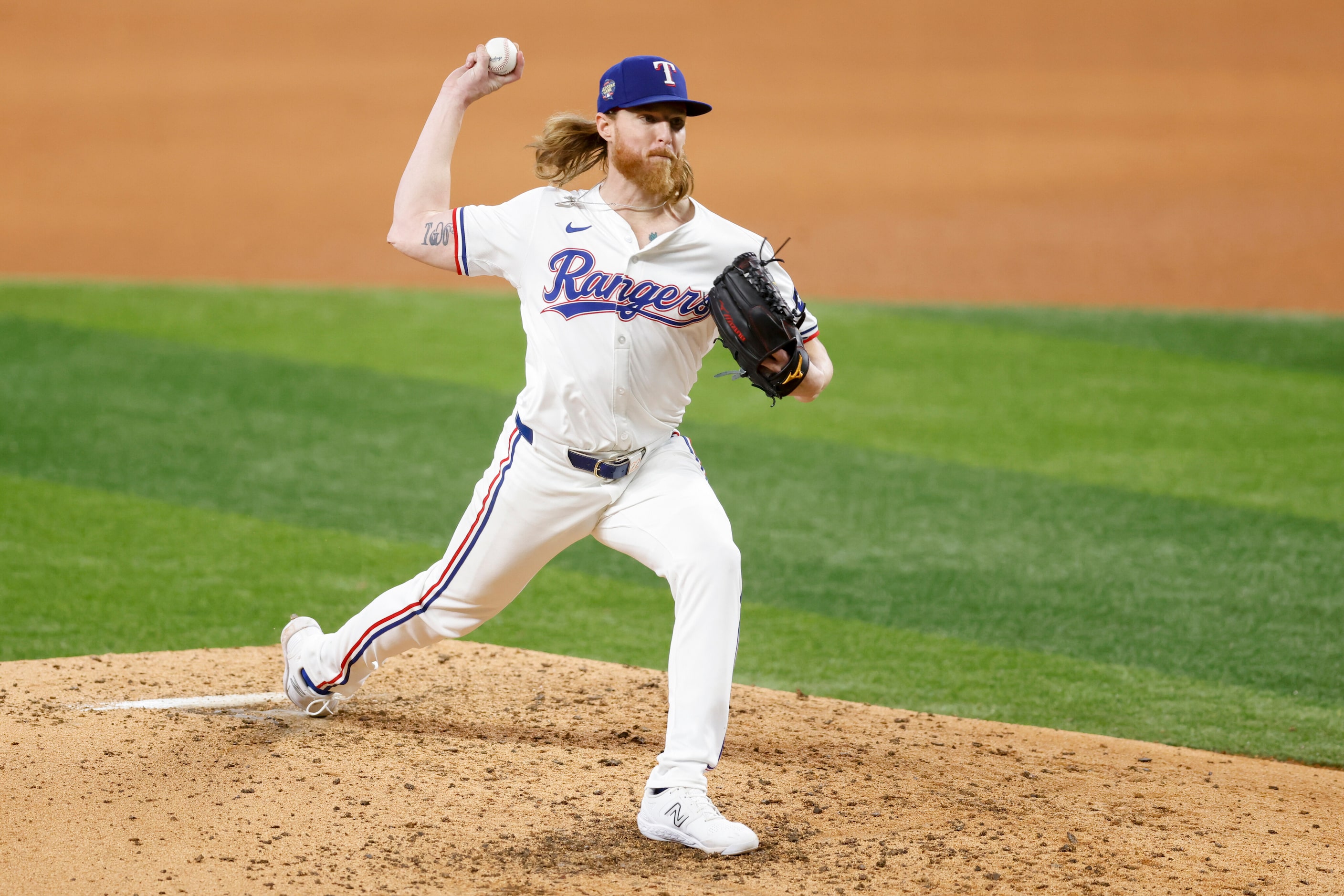 Texas Rangers starting pitcher Jon Gray (22) delivers a pitch during the sixth inning of an...