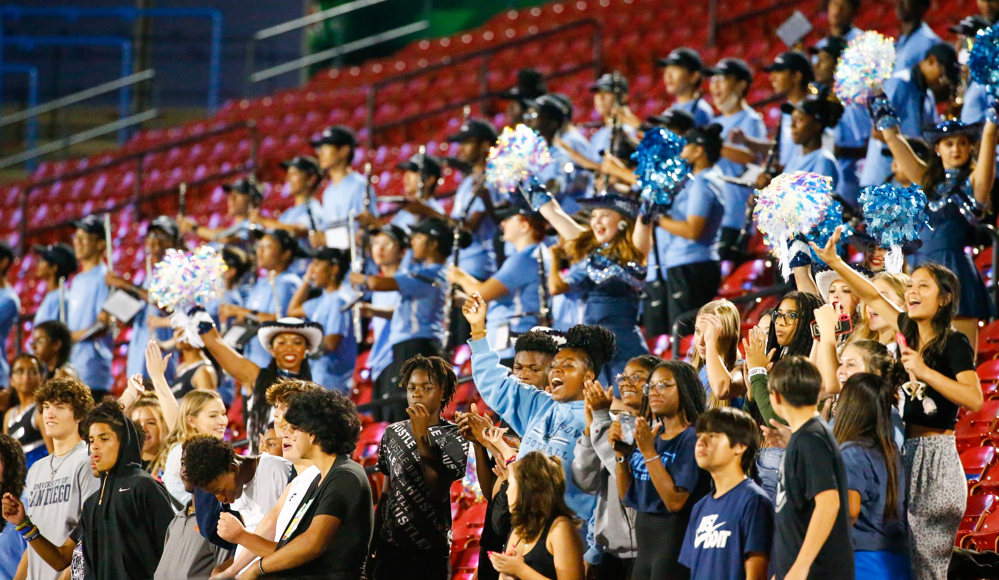 Emerson High School students and fans cheer for the Mavericks as the game ends against the...