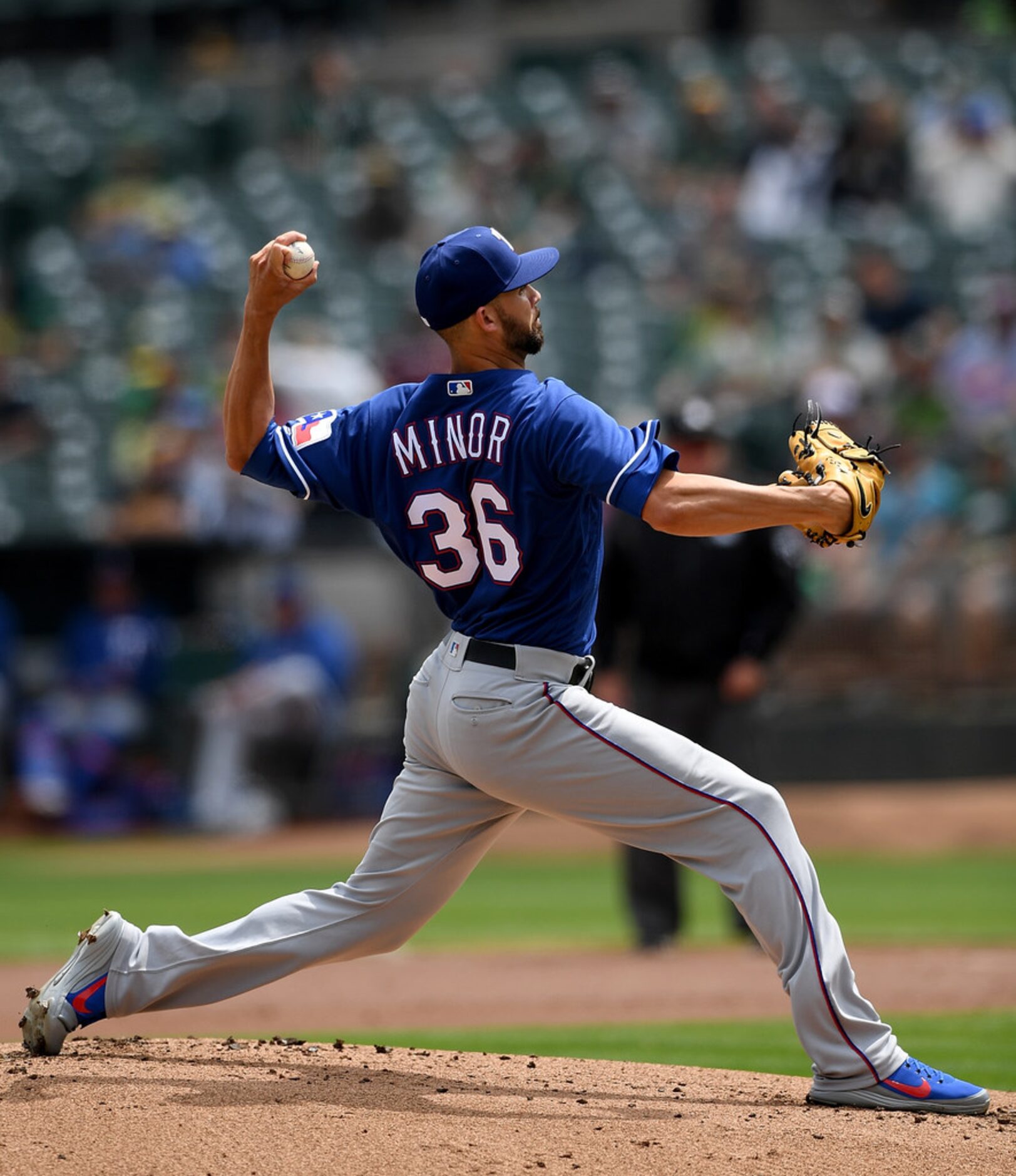 OAKLAND, CA - AUGUST 22:  Mike Minor #36 of the Texas Rangers pitches against the Oakland...