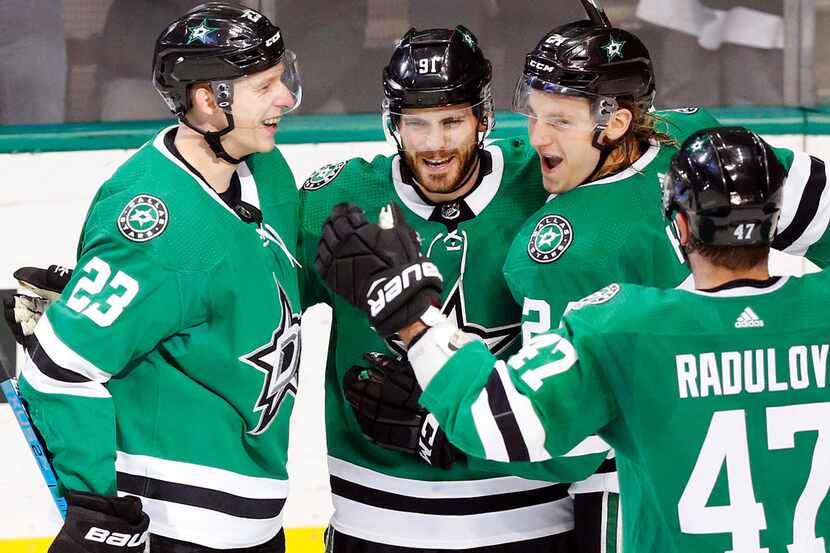 Dallas Stars center Tyler Seguin (91) is congratulated on his second period goal by...